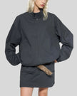 Mid body front view of woman wearing Axis Bomber Jacket in Dark Gray