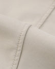 Closeup of smooth cotton-blend performance fabric on Axis Bomber Jacket in Gray Camel