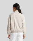 Upper body back view of woman wearing Axis Bomber Jacket in Gray Camel