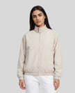 Upper body front view of woman wearing Axis Bomber Jacket in Gray Camel