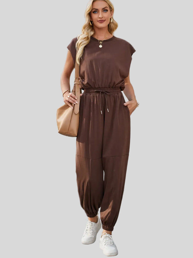 Moss open-back jumpsuit with drawstring waist styled for everyday wear