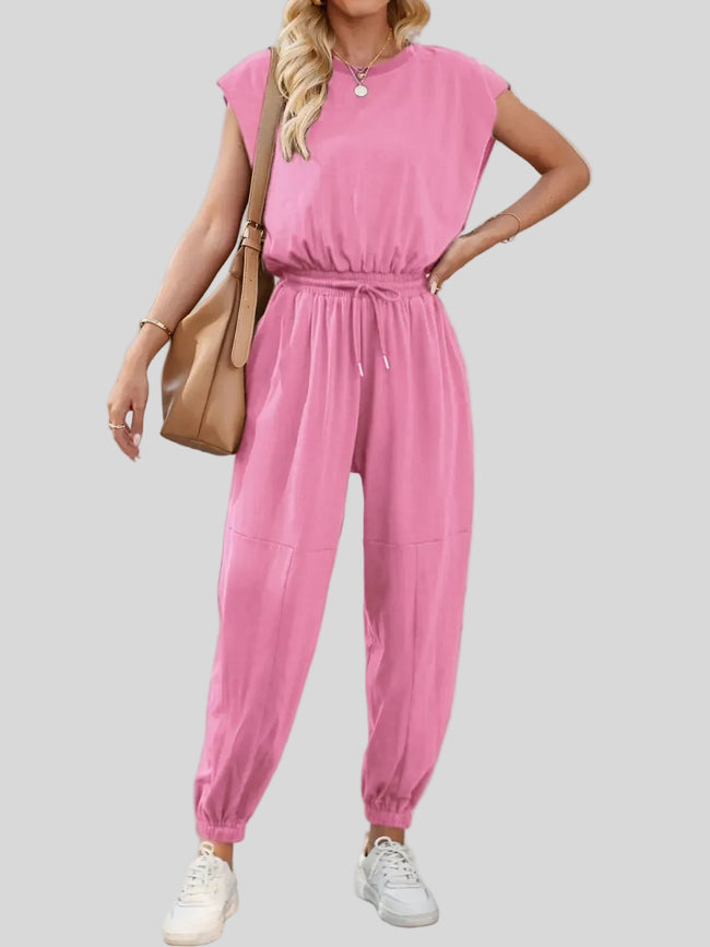 Open-back drawstring waist jumpsuit in Fuchsia Pink shown from the front