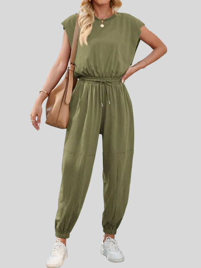 Open-back drawstring waist jumpsuit in Moss showing drawstring waist from angled front view