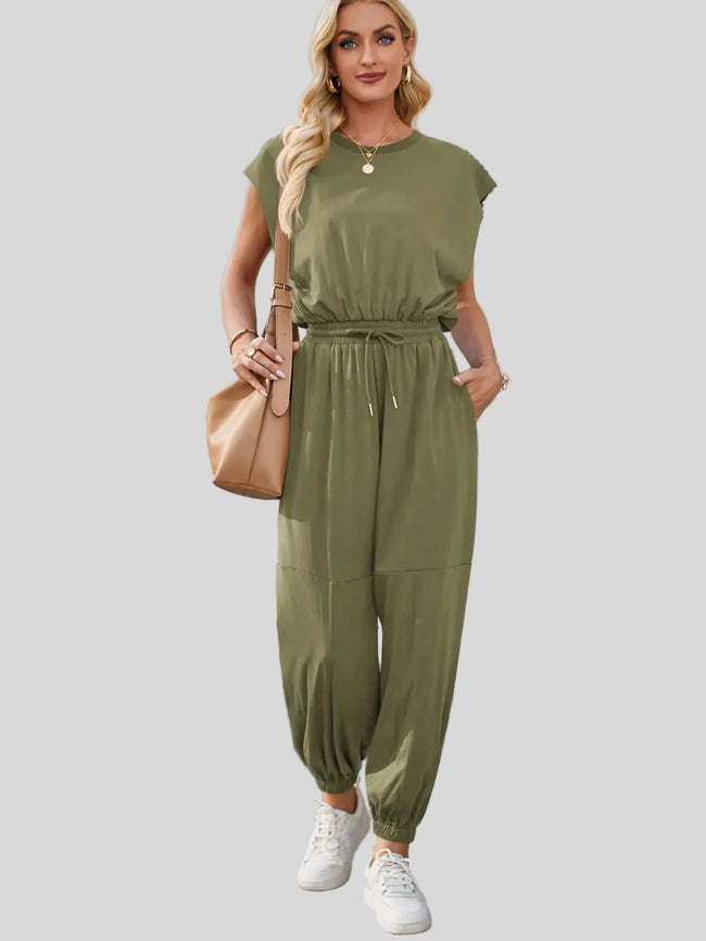 Moss open-back jumpsuit with drawstring waist styled for everyday wear