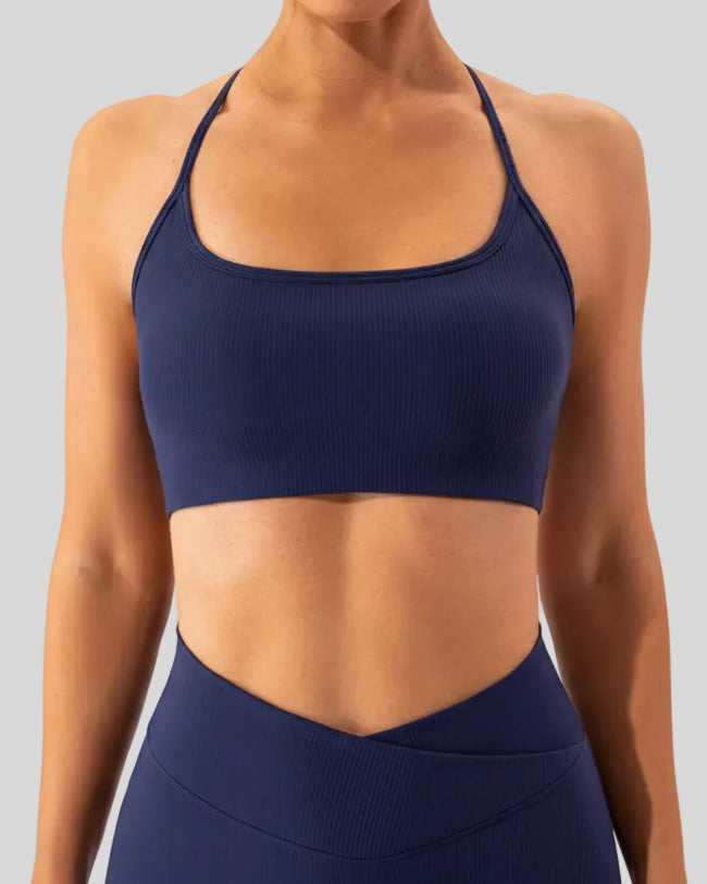 Close-up of smooth minimalist sports bra fabric in dark blue