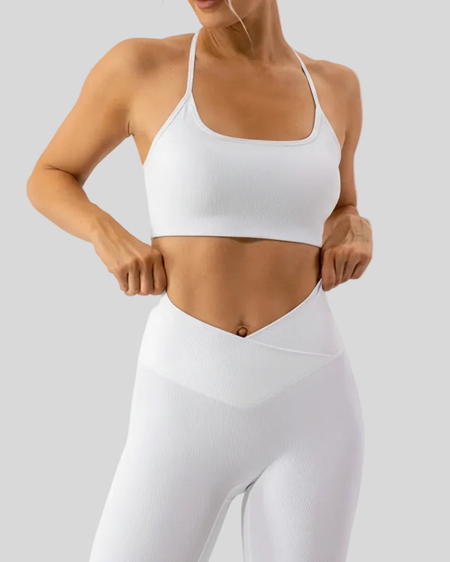 Minimal spaghetti strap sports bra in white shown from the front