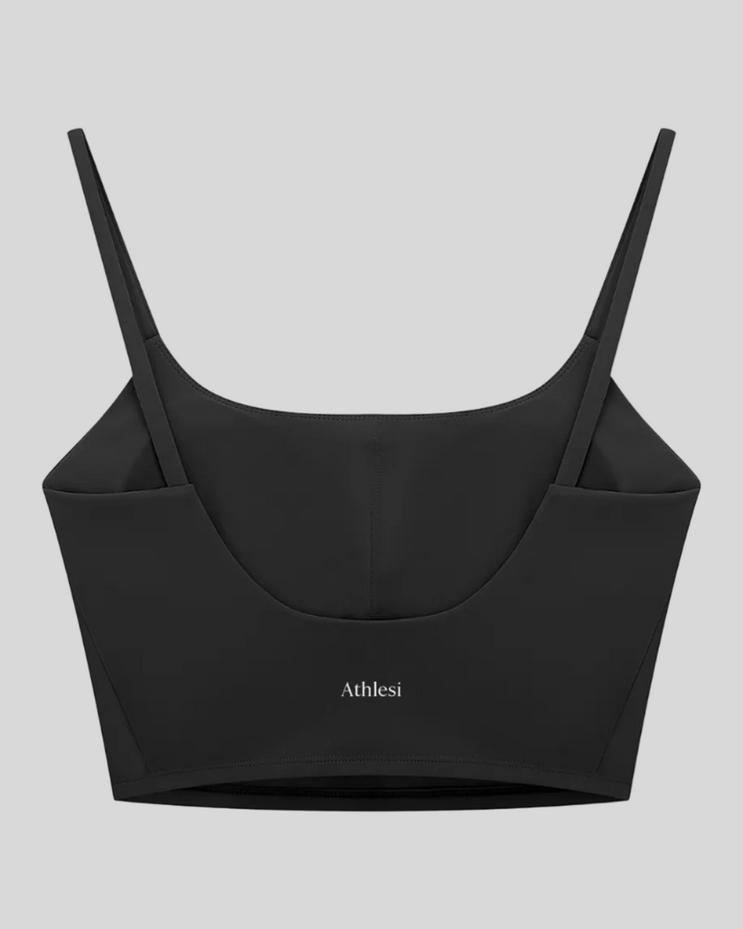 BaseLine Sports Bra in black, flatlay back view with clean minimal design