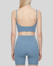 BaseLine Sports Bra in gray blue, mid body back view