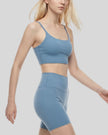 BaseLine Sports Bra in gray blue, angled front view showing fit