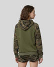 Mid body back view of woman wearing army green Camo Accent Hoodie with green camo hood and sleeves