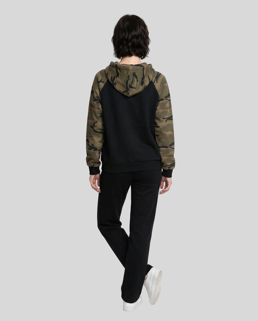 Full body back view of woman wearing Camo Accent Hoodie in black with green camo hood and sleeves