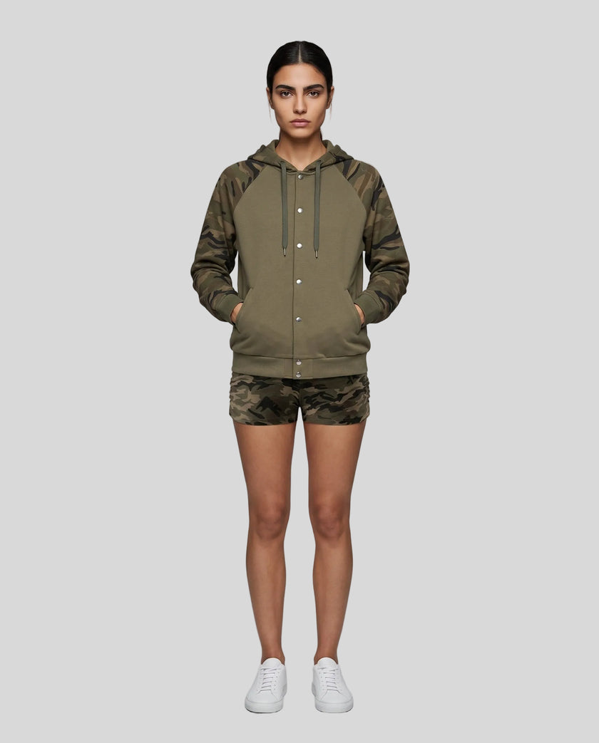 Full body front view of woman wearing Camo Accent Hoodie in khaki with green camo hood and sleeves