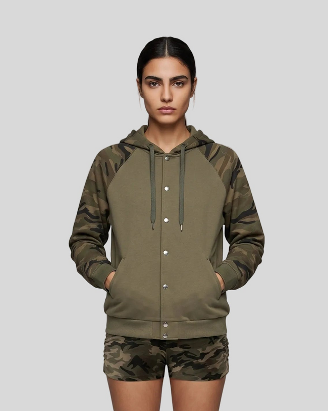 Mid body front view of woman wearing Camo Accent Hoodie in khaki with green camo sleeves