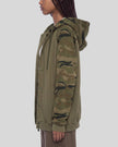 Upper body side view of woman wearing Camo Accent Hoodie in khaki with green camo sleeves