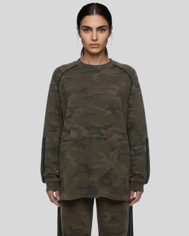 Mid body front view of woman wearing Camo Accent Long Sleeve Tee in army green camo
