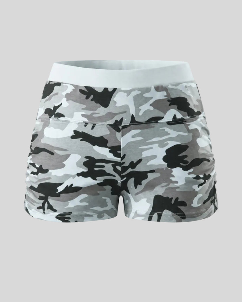 Women's camouflage slim shorts front view in Light Blue Camo with elastic waistband and side ruching