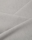 A close-up of light blue Camo Tube Top fabric interior texture, folded diagonally to show the material's drape and texture.