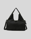 CarryForm Studio Bag in black front view with structured silhouette and soft handles