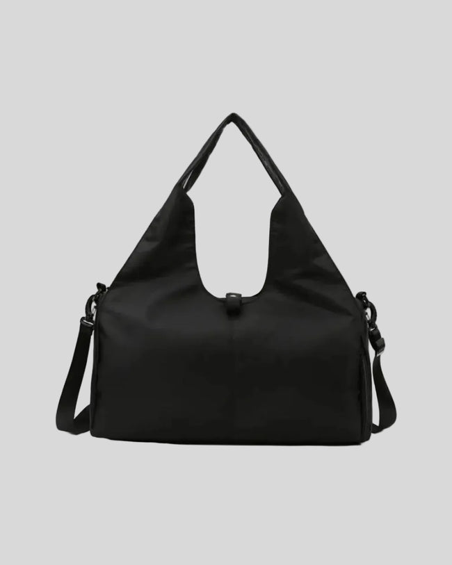 CarryForm Studio Bag in black front view with structured silhouette and soft handles