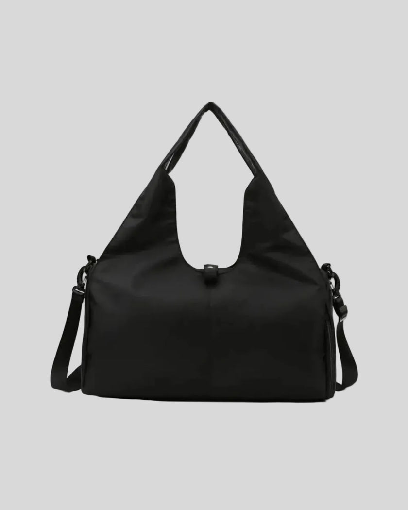CarryForm Studio Bag in black front view with structured silhouette and soft handles
