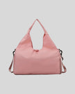CarryForm Studio Bag in dusty pink front view with structured silhouette and soft handles