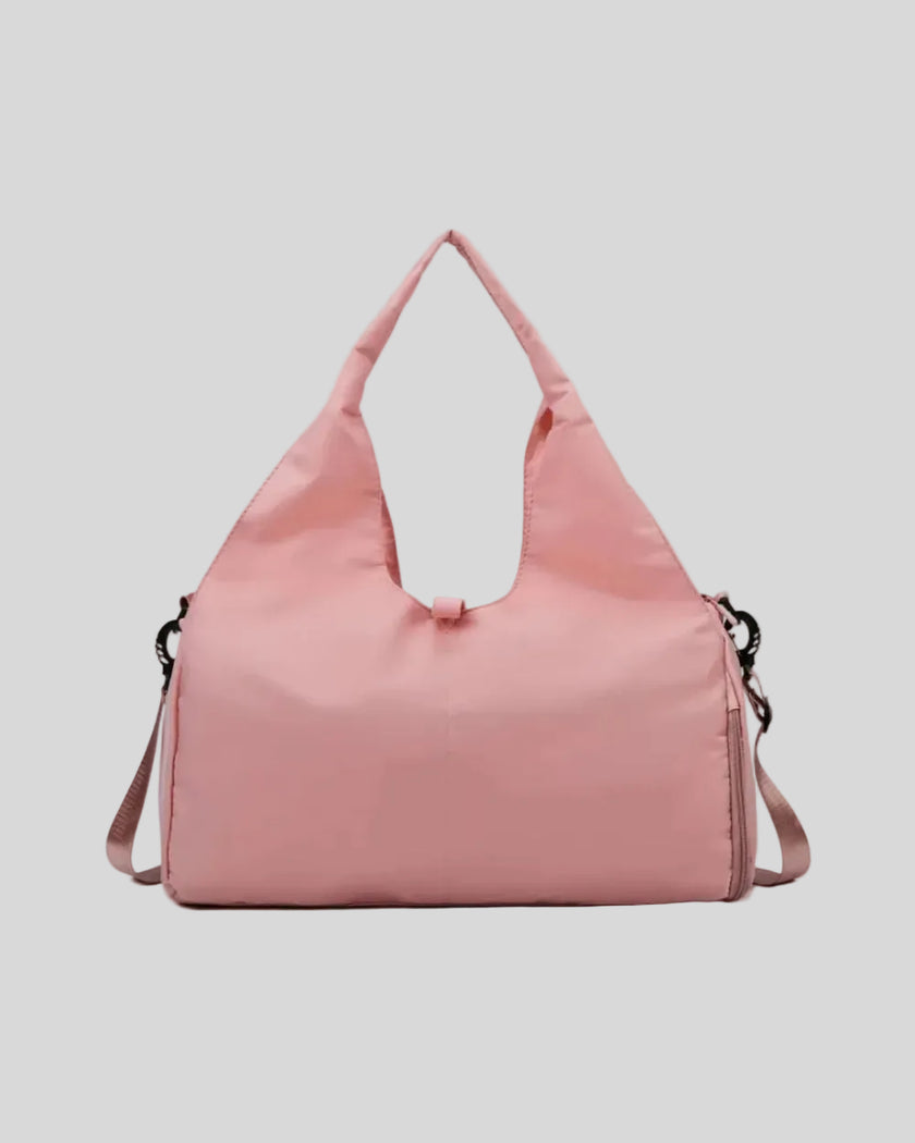 CarryForm Studio Bag in dusty pink front view with structured silhouette and soft handles