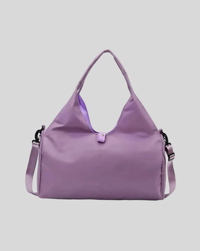 CarryForm Studio Bag in red violet front view with structured silhouette and soft handles