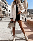 Full body view of white CityLine tailored blazer styled with modern citywear aesthetic and polished layering design