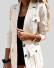 Closeup look of woman wearing white CityLine tailored blazer with structured lapel collar and pocket details