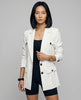 Woman wearing white CityLine tailored blazer with structured lapel collar and pocket details styled for elevated streetwear looks