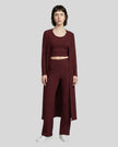 Woman wearing the CloudEase Lounge Set in burgundy front view with cropped tank wide-leg pants and long sleeve cover-up