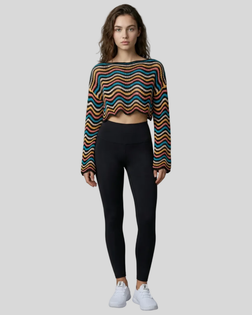 Front full-body view of the Athlesi ColorRush Wave Knit Top in multicolor layered over an Athlesi sports bra and leggings