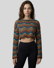 Front mid-body view of the Athlesi ColorRush Wave Knit Top in multicolor styled as a modern layering piece over Athlesi activewear