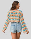 Back mid-body view of the Athlesi ColorRush Wave Knit Top featuring multicolor wave stripe design in tan