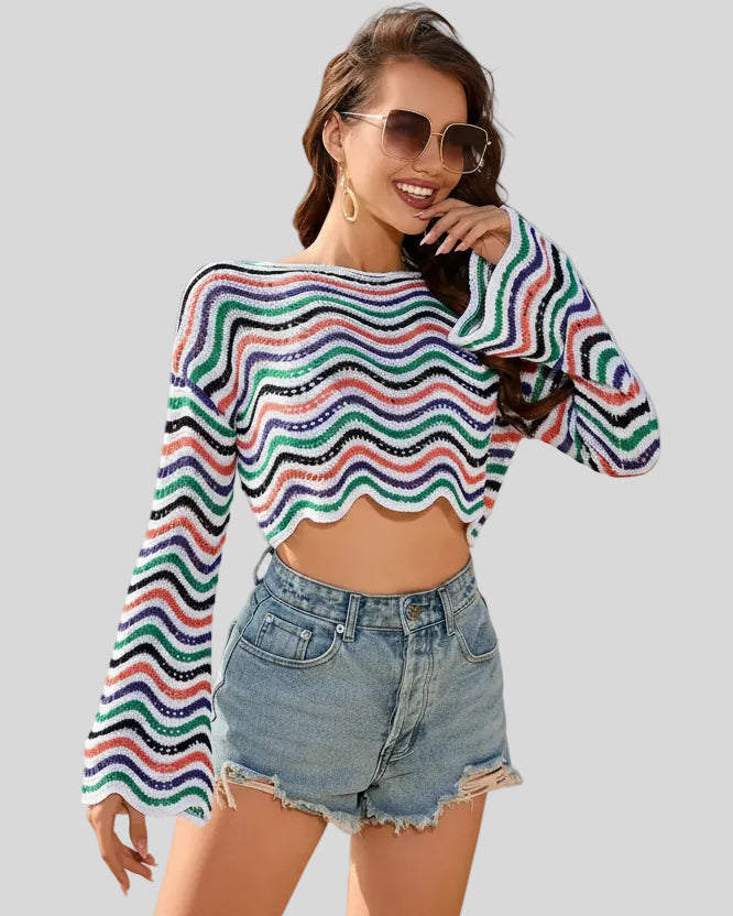 Front angled mid-body view of the Athlesi ColorRush Wave Knit Top showing wave stripe knit texture in white