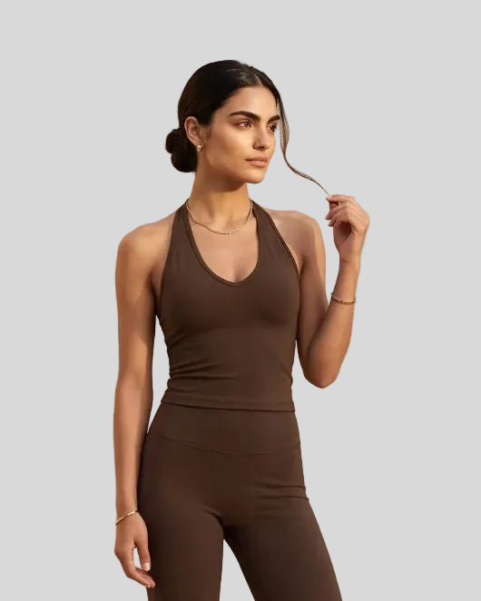 Model wearing the Contour Halter Yoga Tank Top in Brown, front view
