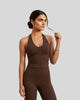 Model wearing the Contour Halter Yoga Tank Top in Brown, front view