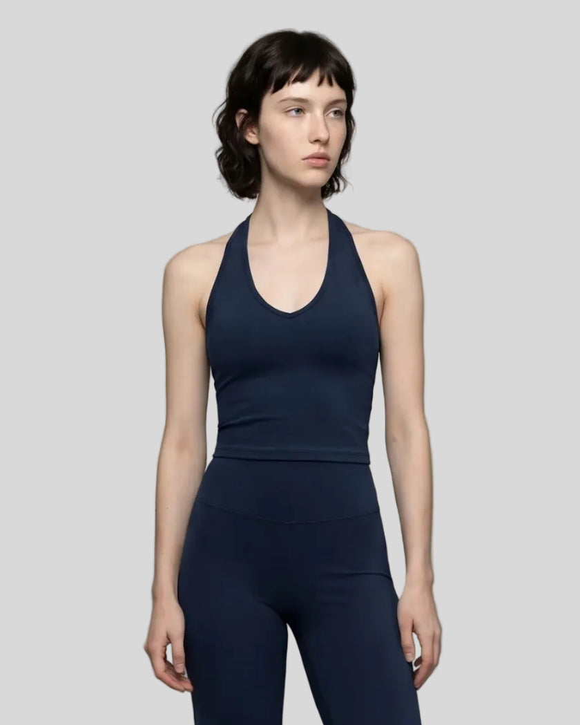 Model wearing the Contour Halter Yoga Tank Top in Navy Blue, front view