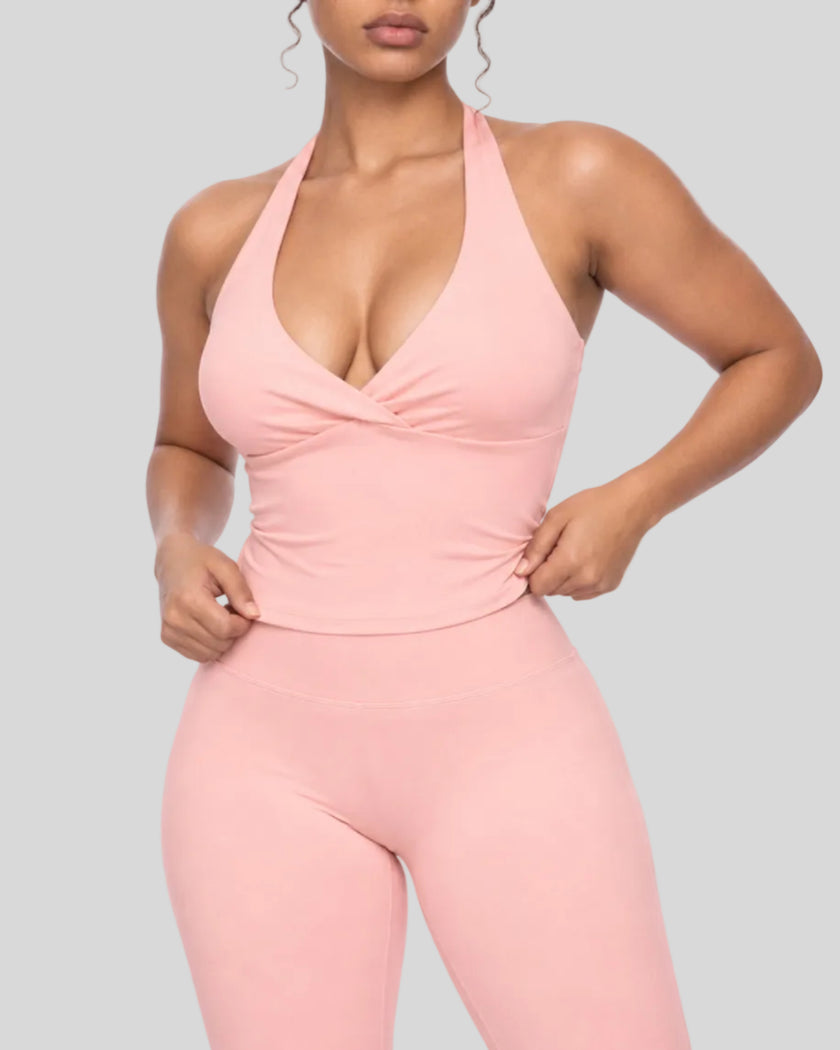 Mid body front view of woman wearing Contour Ruched Yoga Top in pink