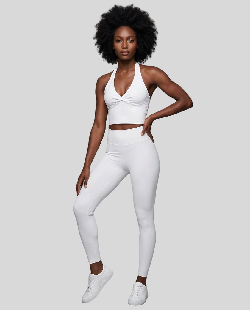 Full body front view of woman wearing Contour Ruched Yoga Top with matching activewear in white