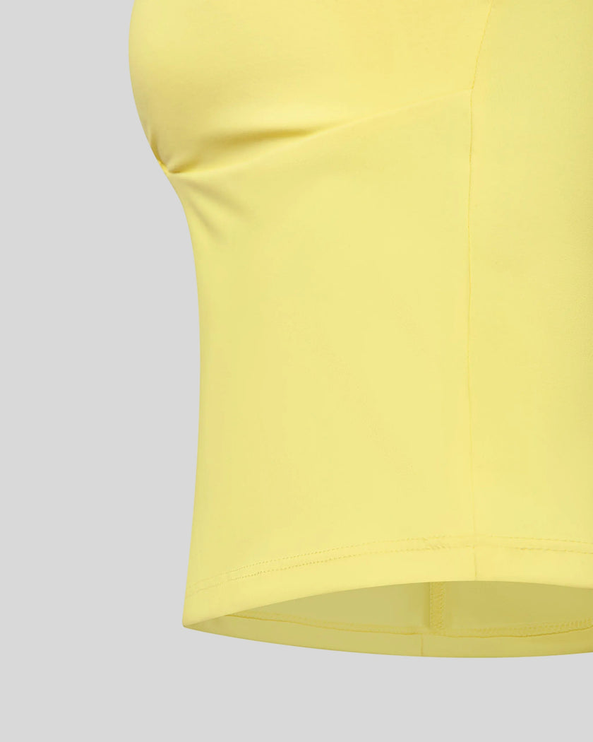 Closeup of ruched crossover underbust detail on Contour Ruched Yoga Top