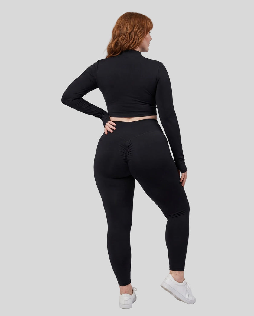 Full body back view of woman wearing Contour Yoga Jacket with matching blackactivewear