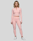 Full body front view of woman wearing Contour Yoga Jacket with matching pink activewear