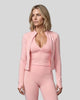 Mid body front view of woman wearing Contour Yoga Jacket in pink unzipped