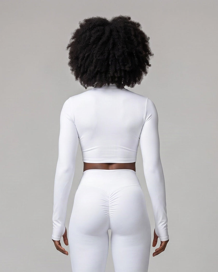 Mid body back view of woman wearing Contour Yoga Jacket in white