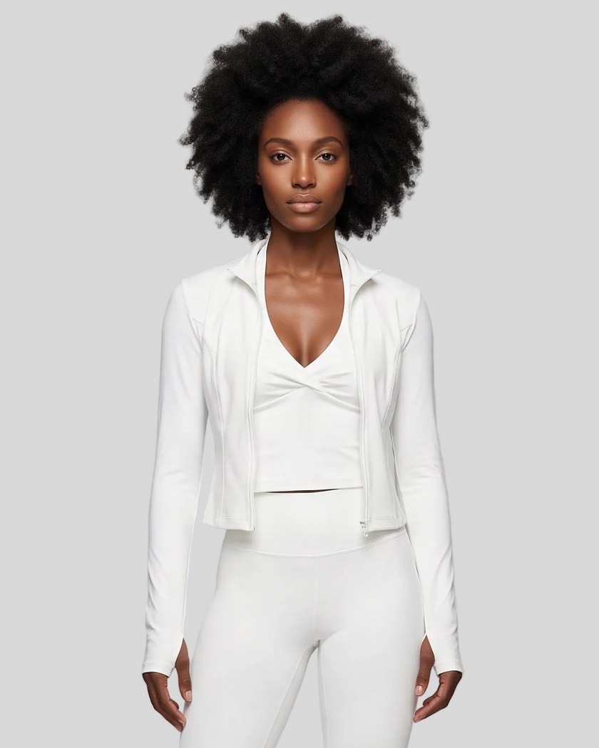 Mid body front view of woman wearing Contour Yoga Jacket in white unzipped