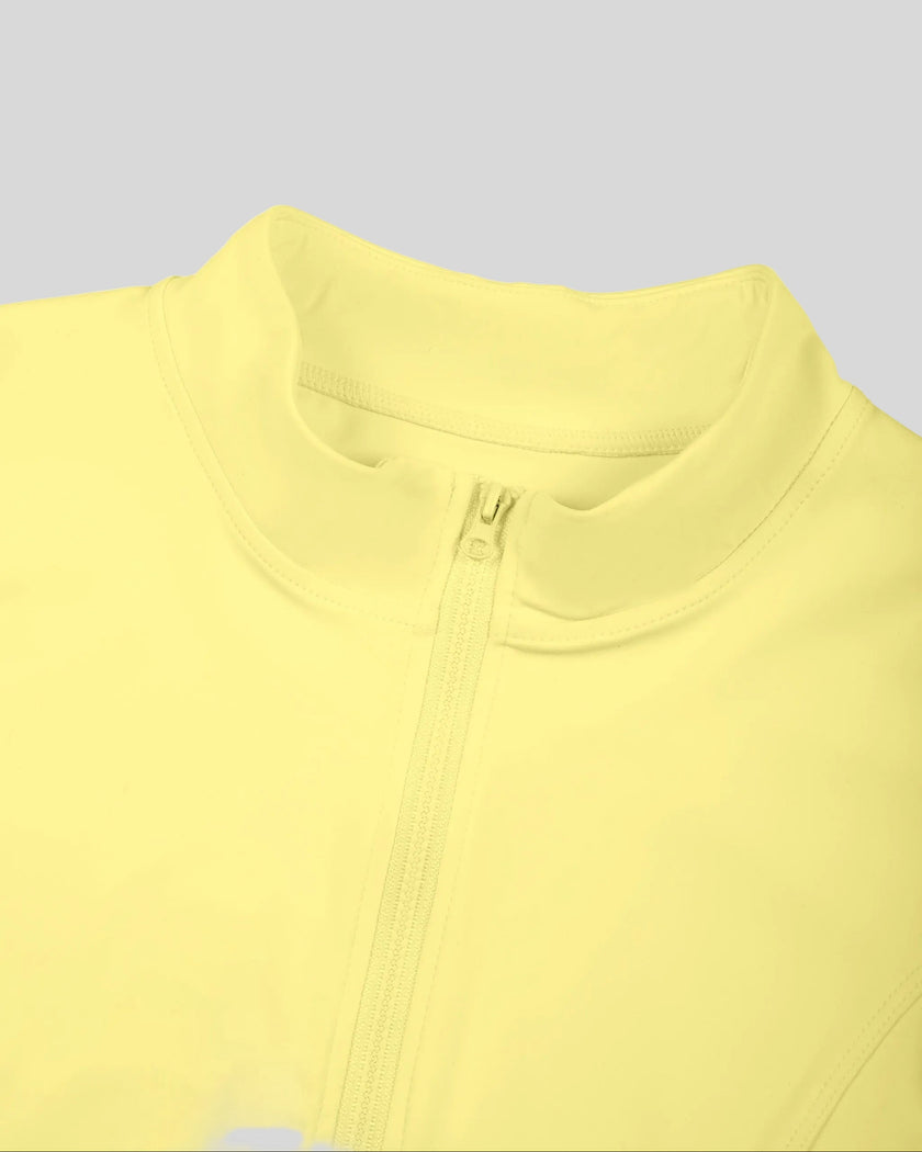 Closeup of stand collar and full-zip front on Contour Yoga Jacket in yellow
