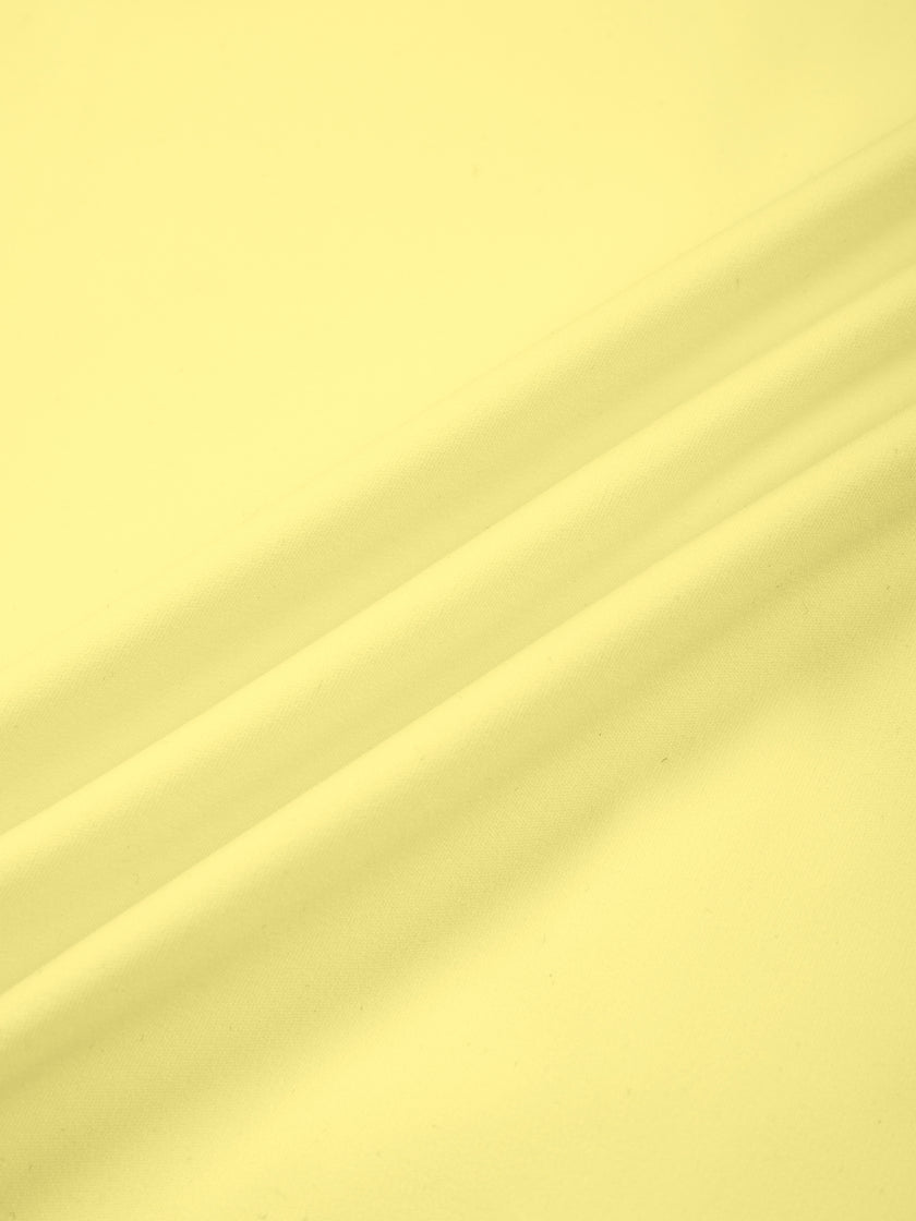 Closeup of smooth yellow nylon stretch fabric on Contour Yoga Jacket