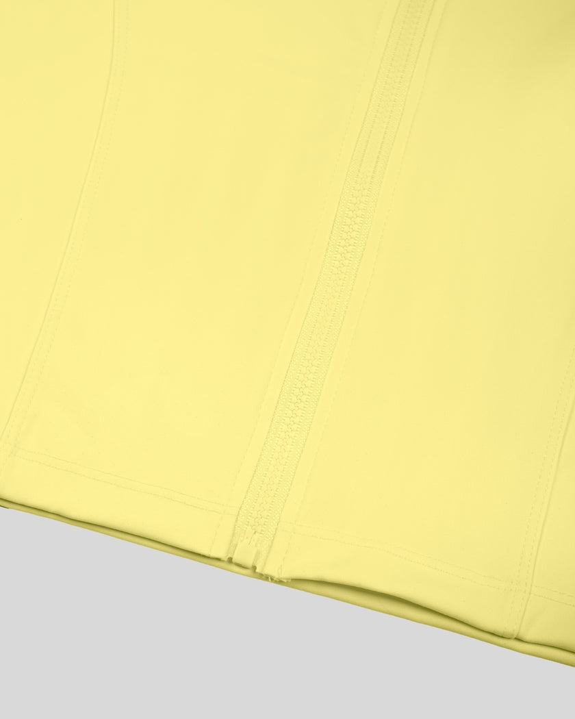 Closeup of front zipper and cropped hem on Contour Yoga Jacket in pink