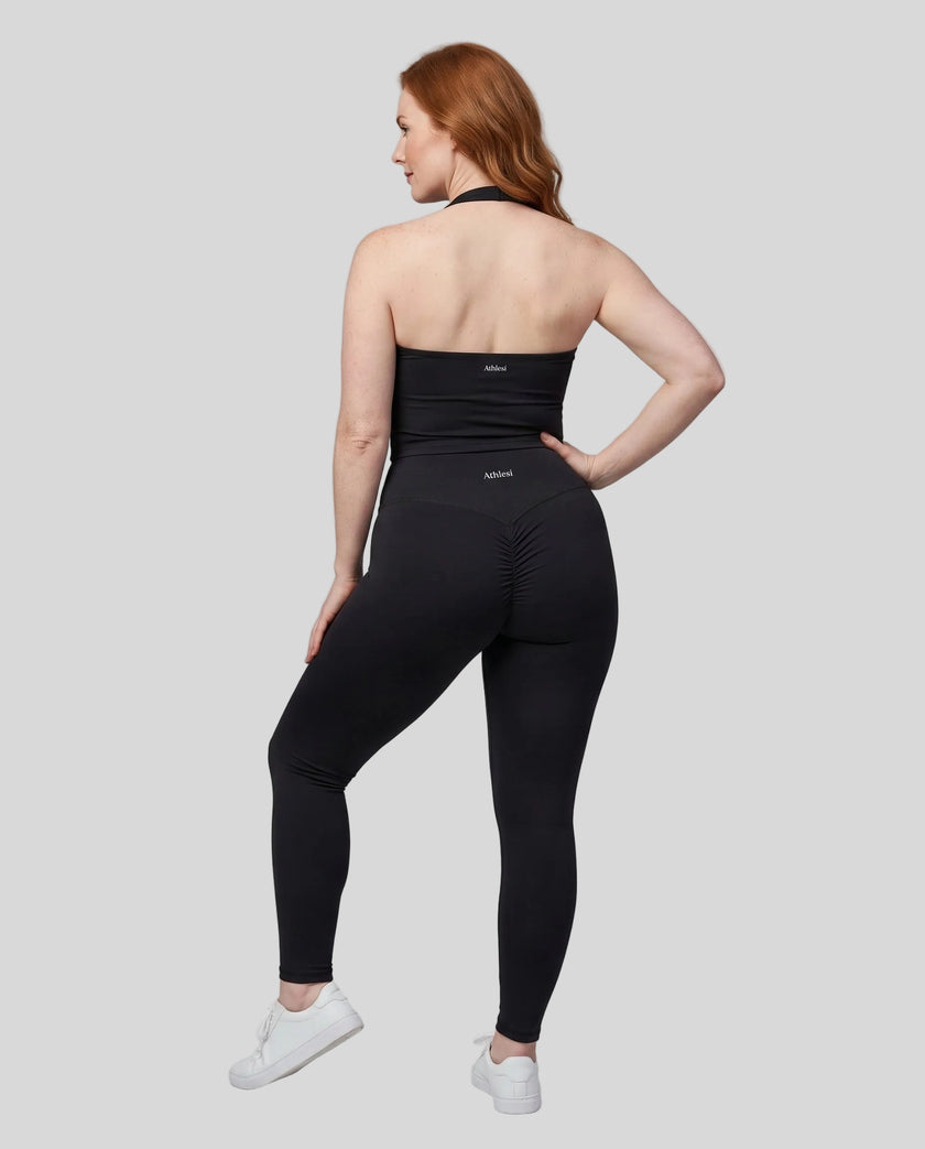 Full body back view of woman wearing Contour Yoga Leggings with matching Contour activewear in black